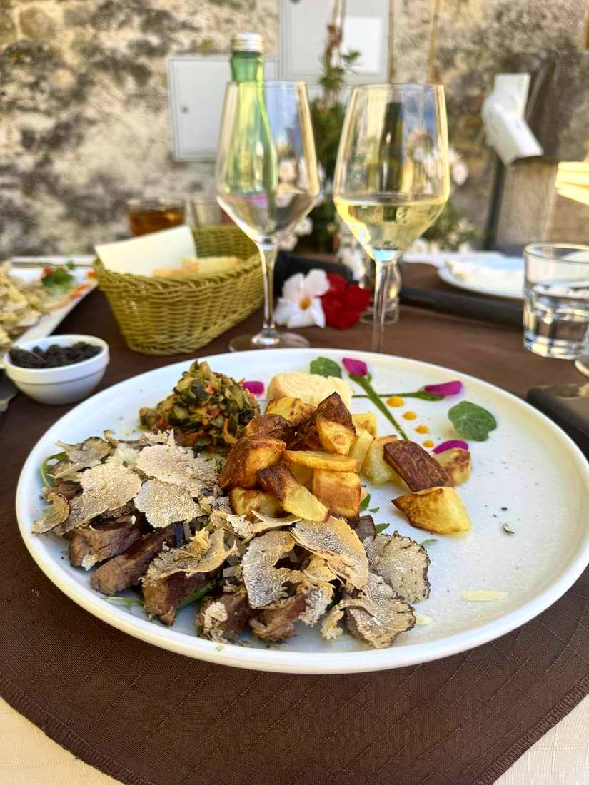 Steak under a blizzard of white truffle