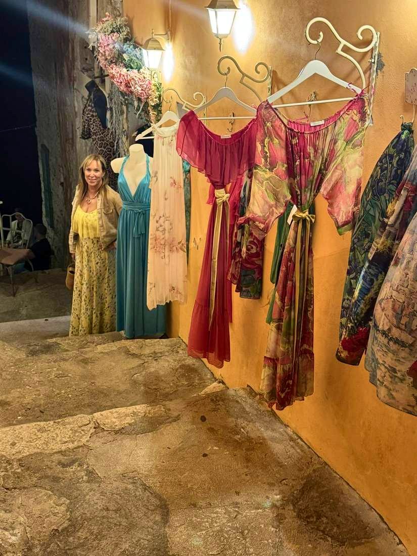Colored dresses in a shop doorway