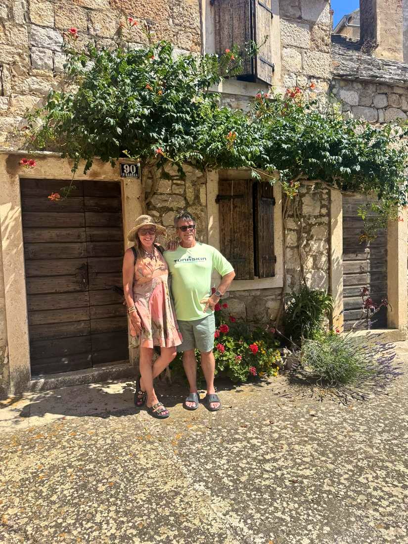 A lane on Vis, flowers over every door