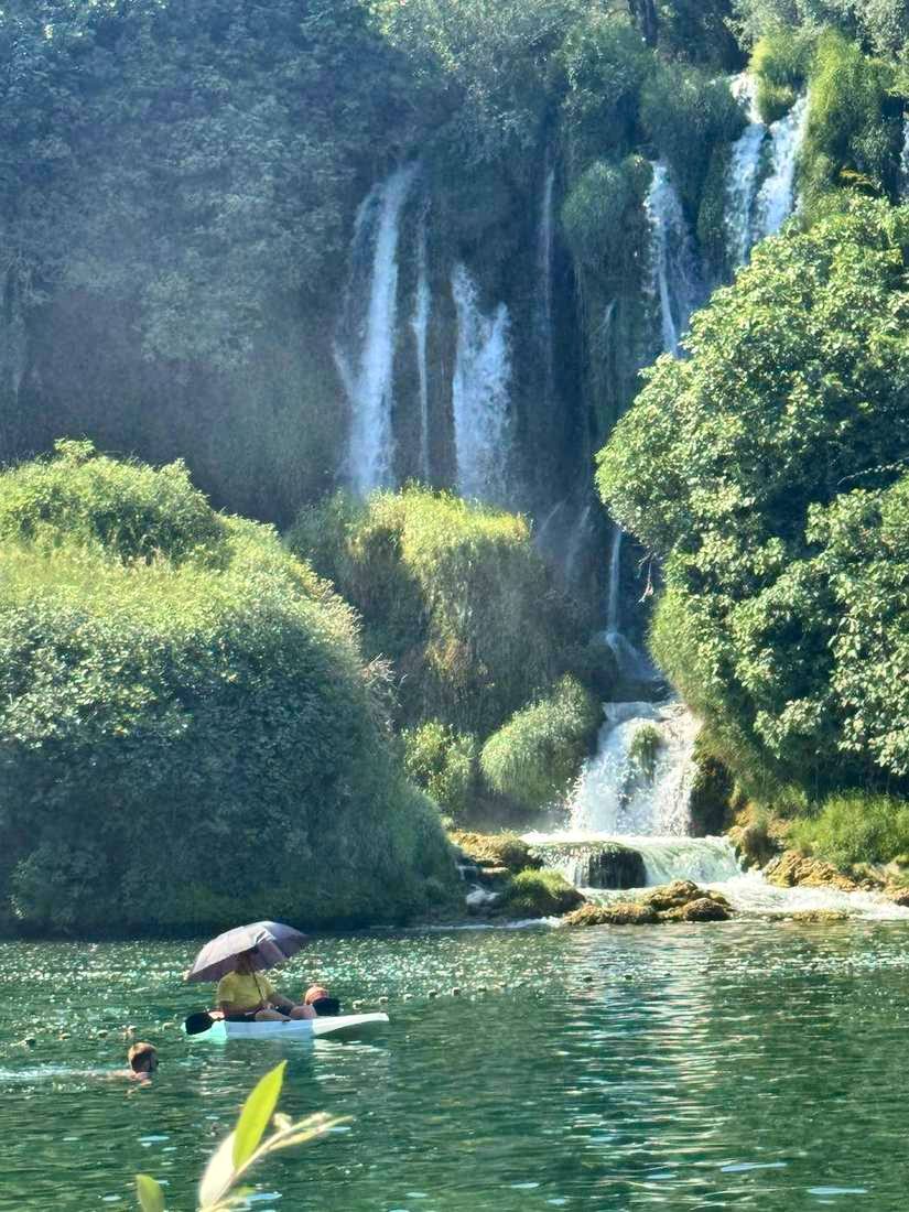 Paddling the pool under a parasol